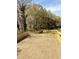 Newly seeded backyard featuring a fresh wooden fence for privacy and security at 3128 Cedar St, Scottdale, GA 30079