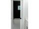 Modern bathroom with a white tub, black accent wall and patterned tile floor at 3128 Cedar St, Scottdale, GA 30079