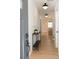 Bright foyer featuring hardwood floors, elegant lighting, and a console table at 3128 Cedar St, Scottdale, GA 30079