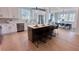Spacious kitchen with island featuring sink, seating, and stainless steel appliances at 3128 Cedar St, Scottdale, GA 30079