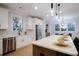 Modern kitchen with stainless steel appliances, an island, and plentiful natural light at 3128 Cedar St, Scottdale, GA 30079