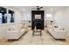 Spacious living room featuring dual sofas, a modern fireplace, and plenty of natural light at 3128 Cedar St, Scottdale, GA 30079