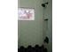 Shower with a tile surround, a shower niche, and matte black fixtures at 3128 Cedar St, Scottdale, GA 30079