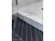 Modern shower features marble surround, tile flooring, glass door, and sleek design at 3128 Cedar St, Scottdale, GA 30079