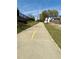 Scenic paved walkway with a yellow line, perfect for a leisurely stroll at 3128 Cedar St, Scottdale, GA 30079