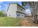 Backyard features a well-maintained lawn and a small patio area at 5125 Cactus Cove Ln, Buford, GA 30519