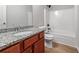 Bathroom features granite countertops, vanity, and shower-tub combination at 5125 Cactus Cove Ln, Buford, GA 30519