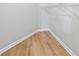 Walk-in closet with wire shelving and durable wood-look flooring at 5125 Cactus Cove Ln, Buford, GA 30519