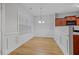 Dining area with wainscoting, hardwood flooring and large picture window at 5125 Cactus Cove Ln, Buford, GA 30519