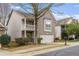 Charming two-story home with brick facade, balcony and attached two-car garage at 5125 Cactus Cove Ln, Buford, GA 30519
