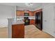 Charming kitchen with wood cabinets, stainless appliances, and granite countertops at 5125 Cactus Cove Ln, Buford, GA 30519