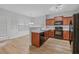 Charming kitchen with wood cabinets, stainless appliances, and granite countertops at 5125 Cactus Cove Ln, Buford, GA 30519