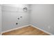Laundry room boasts resilient floors and convenient washer-dryer hookups at 5125 Cactus Cove Ln, Buford, GA 30519