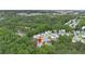 Aerial view of the home's location within a community, with mature trees providing a private setting at 7040 Magnolia Park Ln, Norcross, GA 30093