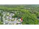 Aerial neighborhood view shows the property nestled among mature trees providing a private setting in a residential community at 7040 Magnolia Park Ln, Norcross, GA 30093