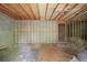 Unfinished basement with exposed framing and concrete walls offers the perfect space for future customization and storage at 7040 Magnolia Park Ln, Norcross, GA 30093