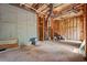 Unfinished basement with wood framing and concrete walls at 7040 Magnolia Park Ln, Norcross, GA 30093