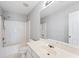 Well lit bathroom featuring a shower and tub at 7040 Magnolia Park Ln, Norcross, GA 30093