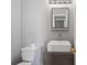 Modern bathroom featuring a square sink, vanity, and contemporary lighting at 7040 Magnolia Park Ln, Norcross, GA 30093