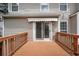 Wooden deck with back of home and sliding glass doors in background at 7040 Magnolia Park Ln, Norcross, GA 30093