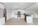 Spacious kitchen with white cabinets, stainless steel appliances, and hardwood floors at 7040 Magnolia Park Ln, Norcross, GA 30093