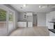 Bright kitchen featuring white cabinets, hardwood floors, and access to the outdoor deck at 7040 Magnolia Park Ln, Norcross, GA 30093