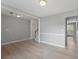 Spacious room with wood floors, neutral walls, a fireplace and view to a deck at 7040 Magnolia Park Ln, Norcross, GA 30093