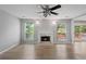 Inviting room with wood floors, fireplace, neutral walls and a sliding door to a deck at 7040 Magnolia Park Ln, Norcross, GA 30093