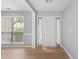 Inviting living room with wood floors, neutral paint, and large windows for natural light at 7040 Magnolia Park Ln, Norcross, GA 30093