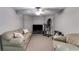 Cozy basement featuring plush sofas, ceiling fan, and fitness equipment for a versatile living space at 2006 Hubbard Ct, Villa Rica, GA 30180