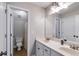 Bright bathroom with double sinks, white cabinets, and a convenient toilet area at 2006 Hubbard Ct, Villa Rica, GA 30180