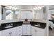 Bright bathroom featuring dual sinks, granite countertops, and custom white cabinetry at 2006 Hubbard Ct, Villa Rica, GA 30180
