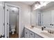 Bright bathroom with double sinks, white cabinets, and a convenient toilet area at 2006 Hubbard Ct, Villa Rica, GA 30180