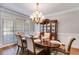 Elegant dining room with a chandelier, china cabinet, and formal table setting at 2006 Hubbard Ct, Villa Rica, GA 30180