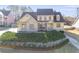 Inviting two-story home featuring a brick and siding facade, complemented by a meticulously landscaped front yard at 2006 Hubbard Ct, Villa Rica, GA 30180