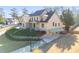 Beautiful two-story home showcasing a well-manicured lawn, driveway, and lush landscaping, creating a welcoming curb appeal at 2006 Hubbard Ct, Villa Rica, GA 30180