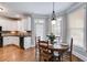 Eat-in kitchen featuring a breakfast nook, wood floors, and stainless steel appliances at 2006 Hubbard Ct, Villa Rica, GA 30180