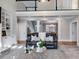 Inviting living room with a fireplace, large windows, plush seating, and open floor plan at 2006 Hubbard Ct, Villa Rica, GA 30180