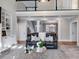 Inviting living room with a fireplace, large windows, plush seating, and open floor plan at 2006 Hubbard Ct, Villa Rica, GA 30180