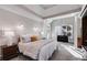 Spacious main bedroom featuring tray ceiling, carpet, and bedside tables with lamps at 2006 Hubbard Ct, Villa Rica, GA 30180