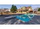 Backyard pool with diving board, lounge chairs, and mature landscaping at 2006 Hubbard Ct, Villa Rica, GA 30180
