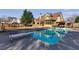Large backyard pool with diving board, patio seating and mature landscaping at 2006 Hubbard Ct, Villa Rica, GA 30180
