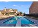 Large backyard pool with diving board, patio seating and mature landscaping at 2006 Hubbard Ct, Villa Rica, GA 30180
