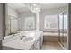Bathroom features a double sink vanity, shower stall and soaking tub at 2620 Milford Ln, Alpharetta, GA 30009