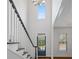 Welcoming foyer with a view of the staircase and a window for natural light at 2620 Milford Ln, Alpharetta, GA 30009