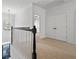 Upstairs hallway landing with carpet, large closets, and a view of the lower floor at 2620 Milford Ln, Alpharetta, GA 30009