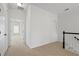 Upstairs hallway with carpeting, white walls, and access to other rooms for a bright, airy feel at 2620 Milford Ln, Alpharetta, GA 30009