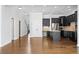 Open-concept space featuring kitchen, living area, and staircase with hardwood floors at 2620 Milford Ln, Alpharetta, GA 30009
