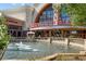 Regal Cinema backdrop, a scenic fountain enhances the entrance and ambiance, inviting entertainment at 2620 Milford Ln, Alpharetta, GA 30009