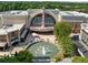 Aerial perspective of the Regal Cinema and outdoor dining area, nestled in a vibrant shopping complex at 2620 Milford Ln, Alpharetta, GA 30009
